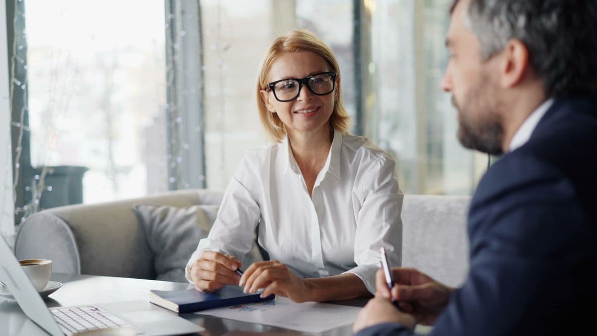 Two professionals in a focused one-on-one conversation